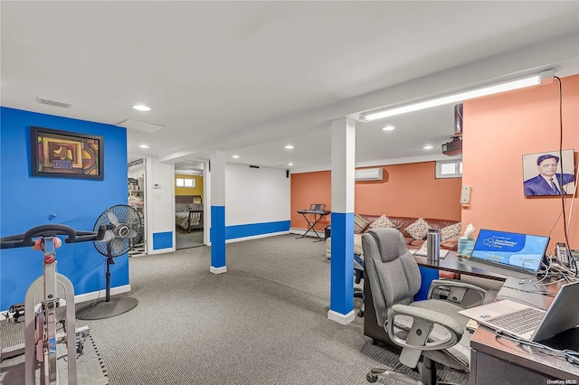 carpeted office space with an AC wall unit