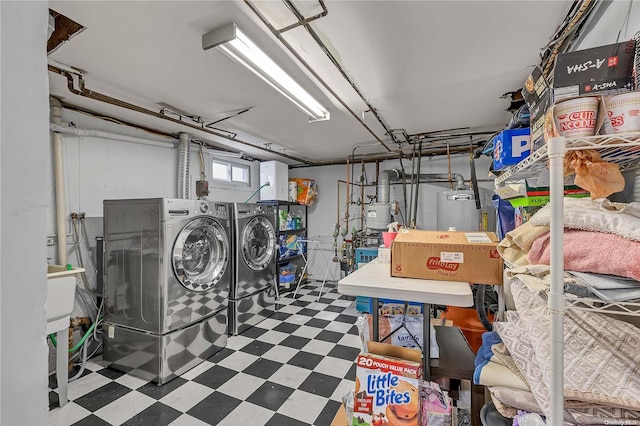 basement with washer and dryer and gas water heater