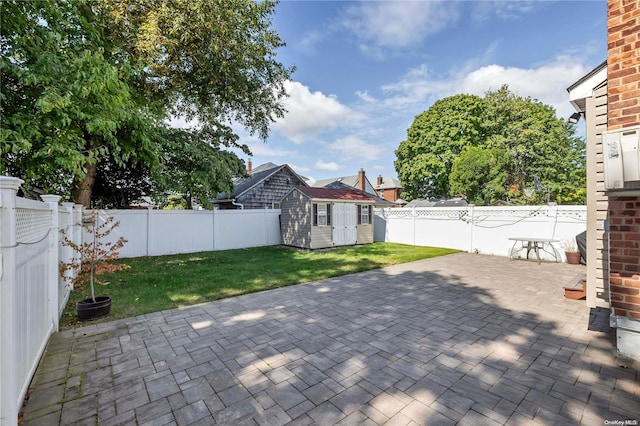 view of patio with an outbuilding