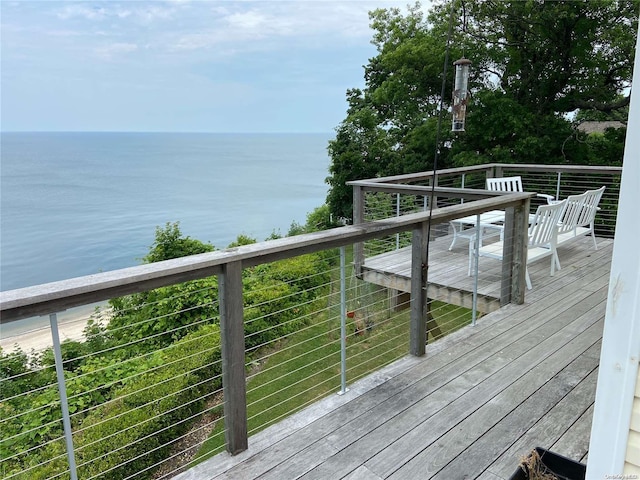 wooden terrace with a water view