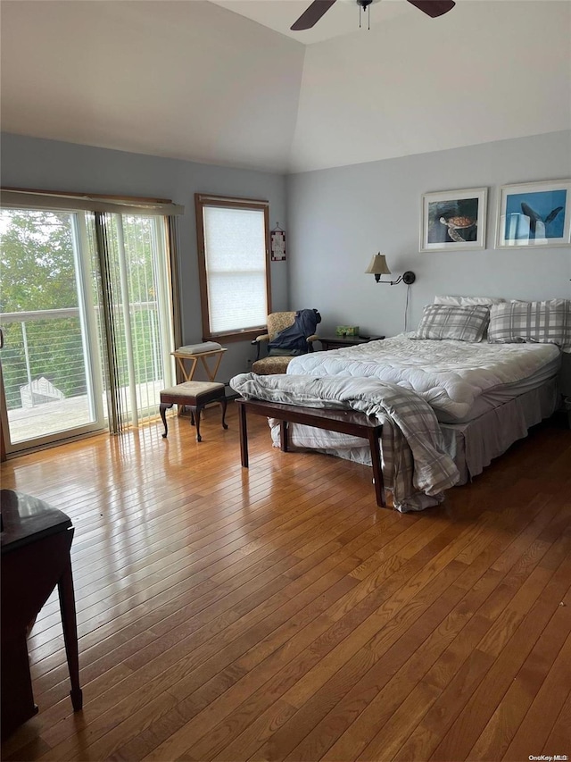 bedroom featuring hardwood / wood-style flooring, ceiling fan, lofted ceiling, and access to outside