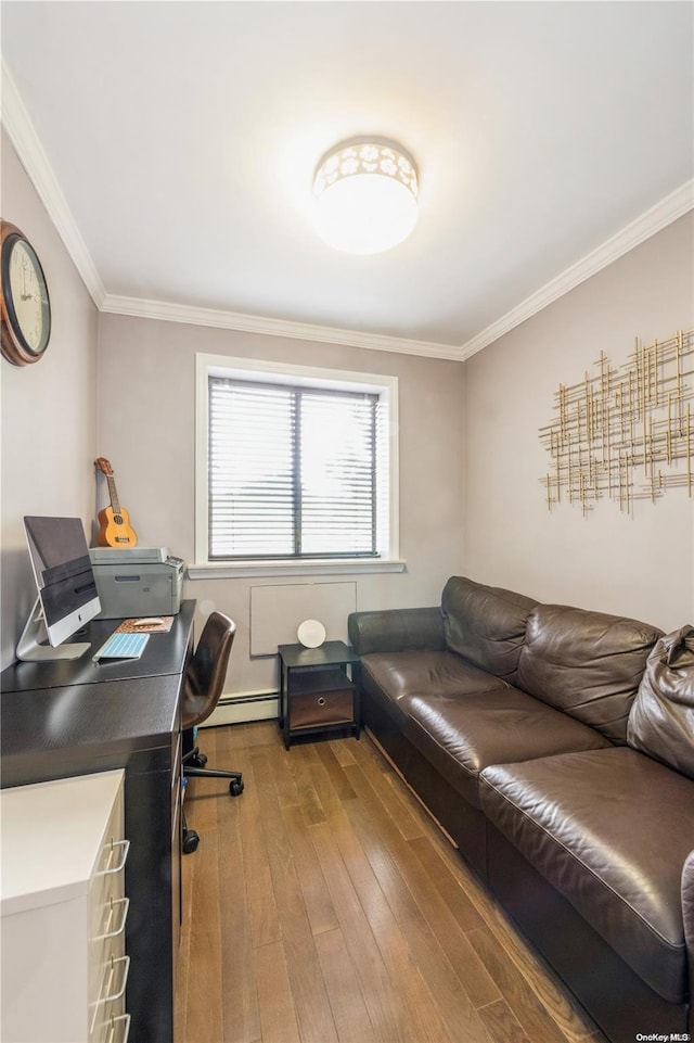 office featuring hardwood / wood-style floors, ornamental molding, and a baseboard heating unit