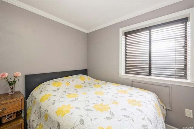 bedroom featuring crown molding