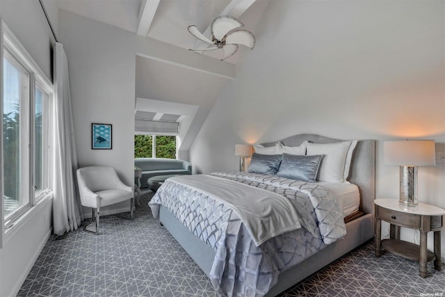 bedroom featuring vaulted ceiling with beams and ceiling fan