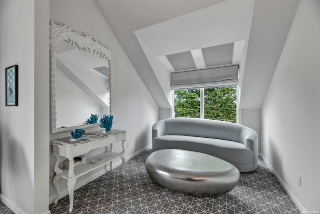 sitting room featuring tile patterned floors and lofted ceiling