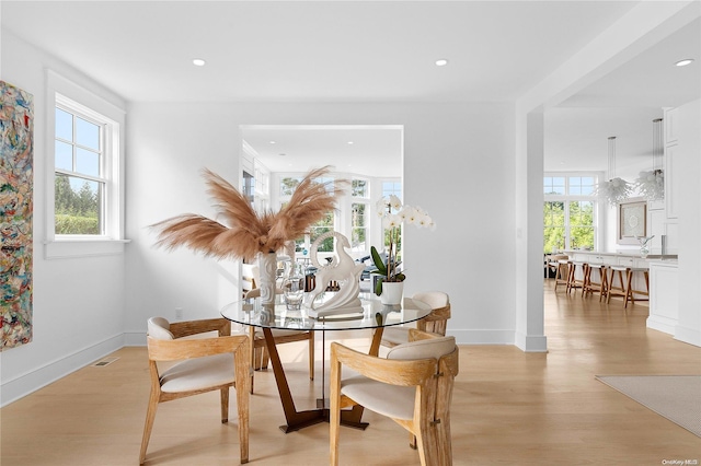 dining area featuring light wood-type flooring