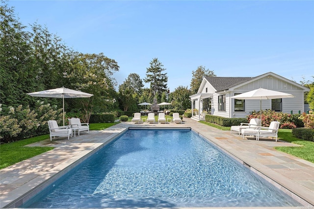 view of swimming pool with a patio area