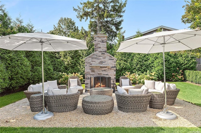 view of patio / terrace featuring an outdoor living space with a fireplace