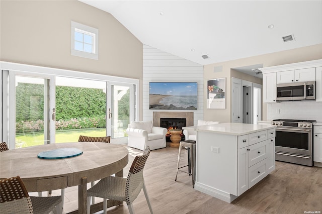 kitchen with white cabinetry, a healthy amount of sunlight, and appliances with stainless steel finishes