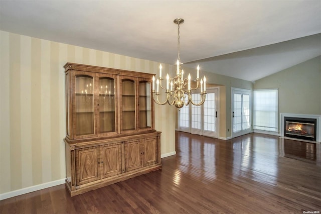 71 Standish Dr Unit 71, Mount Sinai, NY 11766 - unfurnished dining area with wallpapered walls, a chandelier, dark wood-type flooring, a glass covered fireplace, and vaulted ceiling