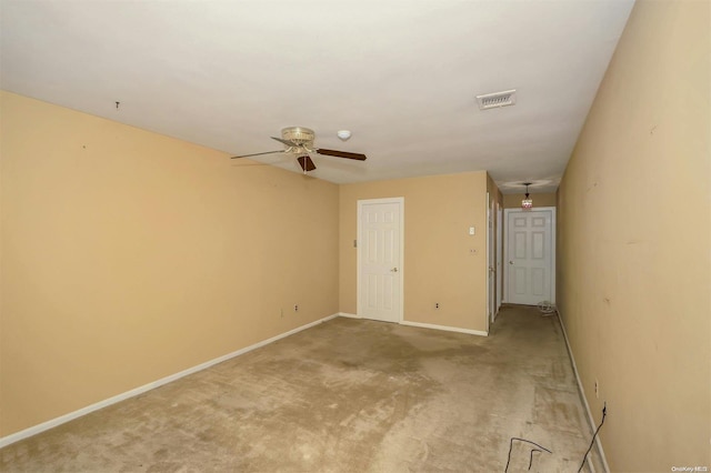 empty room featuring light carpet and ceiling fan