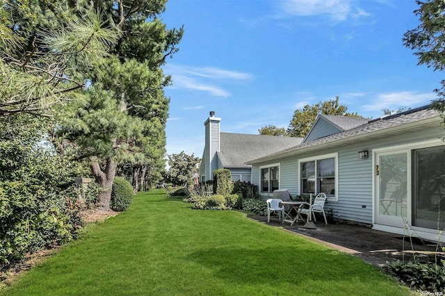 71 Standish Dr Unit 71, Mount Sinai, NY 11766 - view of green lawn with a patio