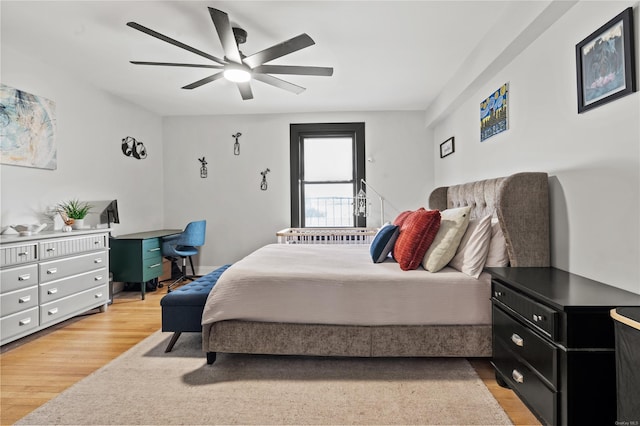 bedroom featuring ceiling fan and light hardwood / wood-style flooring