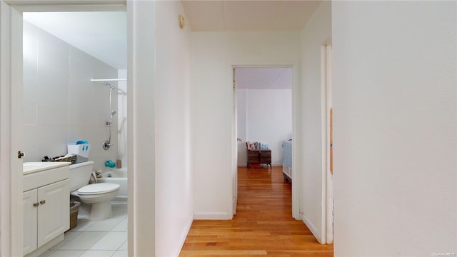 hall with light hardwood / wood-style flooring