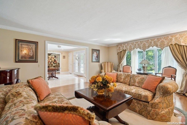 living room featuring light hardwood / wood-style floors and ornamental molding