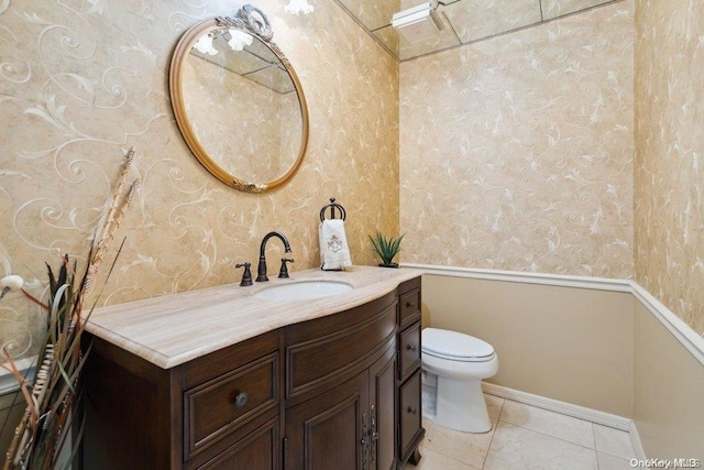 bathroom with tile patterned floors, vanity, and toilet