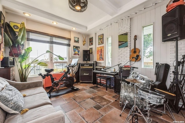 living room with beam ceiling and ornamental molding