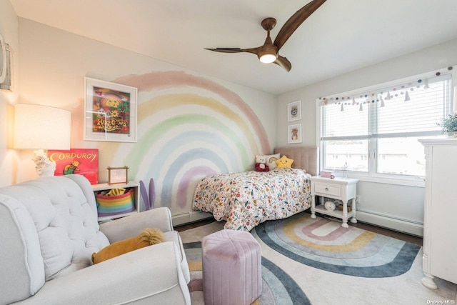 bedroom with a baseboard radiator and ceiling fan