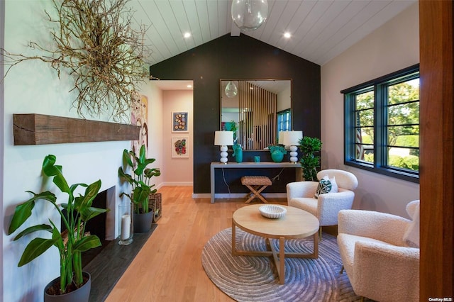 interior space with wood-type flooring and vaulted ceiling