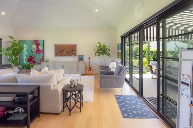 living room featuring light wood-type flooring, high vaulted ceiling, and wooden ceiling