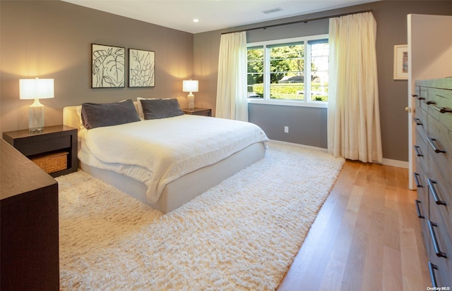 bedroom with light wood-type flooring