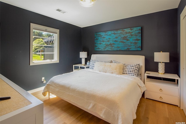 bedroom with light hardwood / wood-style floors