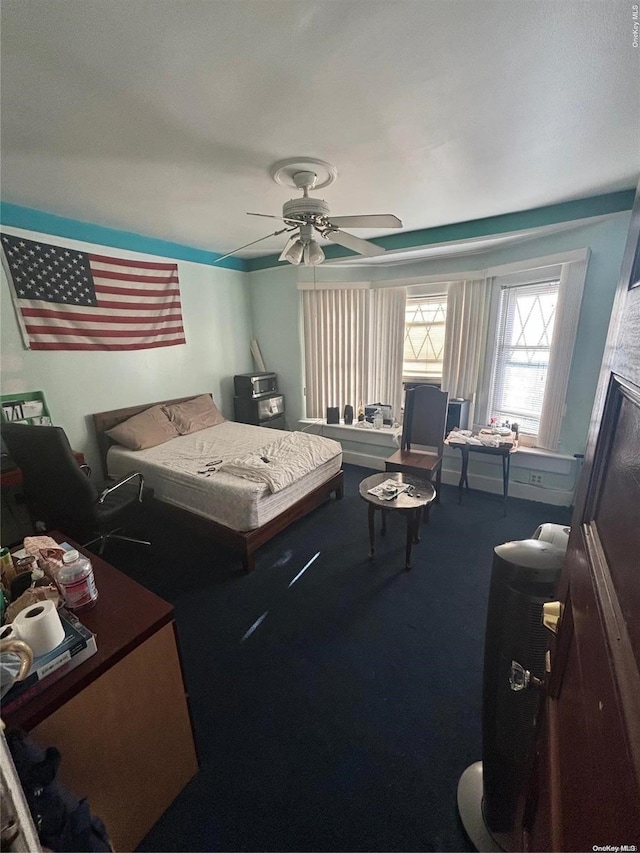 carpeted bedroom featuring ceiling fan