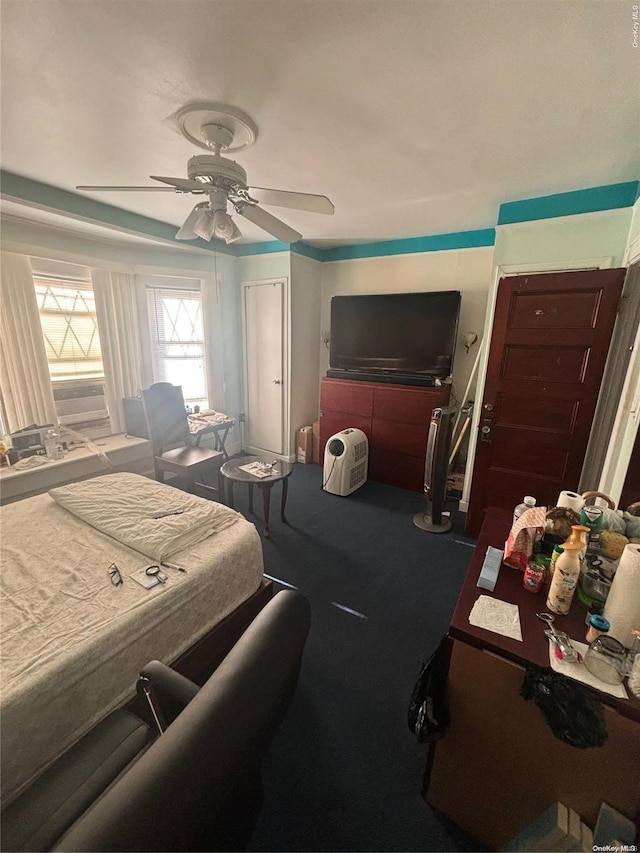 bedroom with ceiling fan and carpet floors