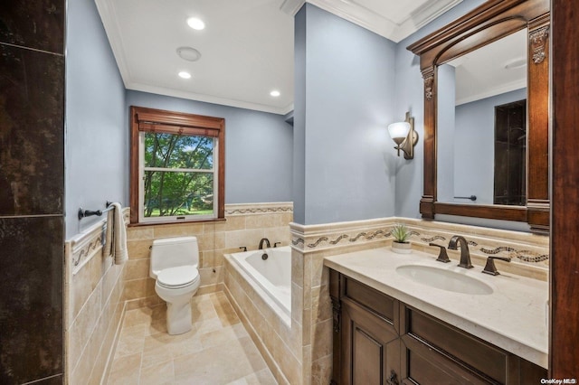 bathroom with tile walls, vanity, crown molding, and toilet