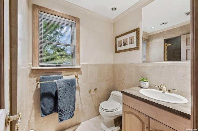 bathroom featuring vanity, tile walls, crown molding, and toilet