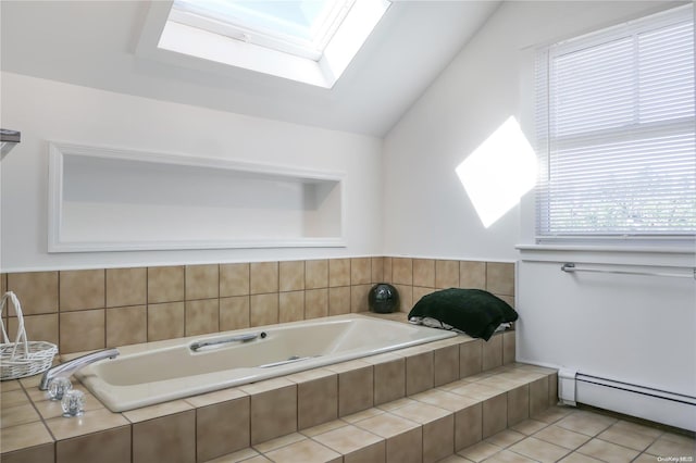 bathroom with tile patterned floors, lofted ceiling with skylight, tiled bath, and a baseboard heating unit