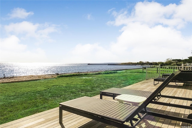 exterior space with a yard and a water view