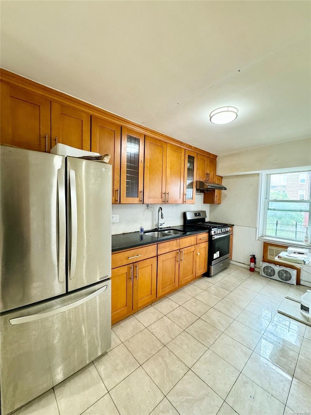 kitchen with light tile patterned flooring, appliances with stainless steel finishes, and sink