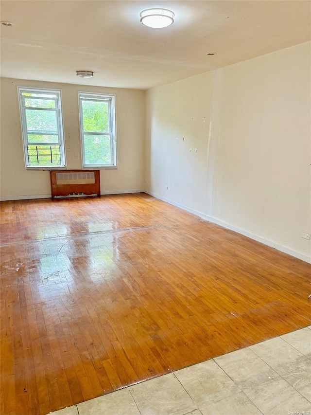 spare room featuring light wood-type flooring