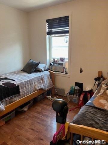 bedroom featuring hardwood / wood-style floors