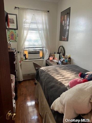 bedroom featuring dark wood-type flooring