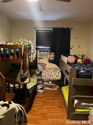 bedroom featuring ceiling fan and light hardwood / wood-style floors