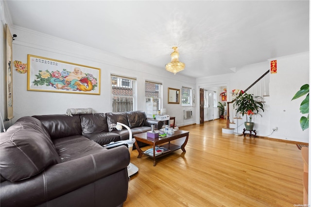 living room with crown molding and light hardwood / wood-style floors