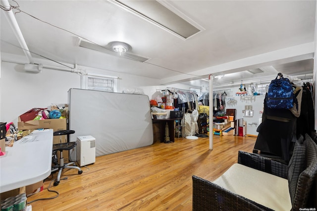 basement featuring hardwood / wood-style flooring