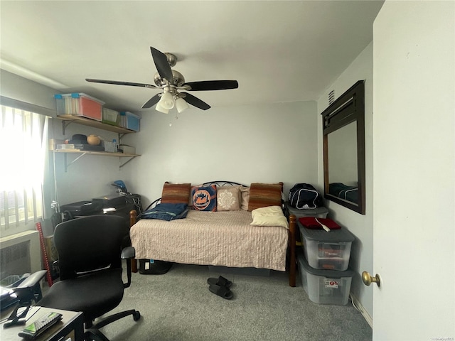 carpeted bedroom with ceiling fan