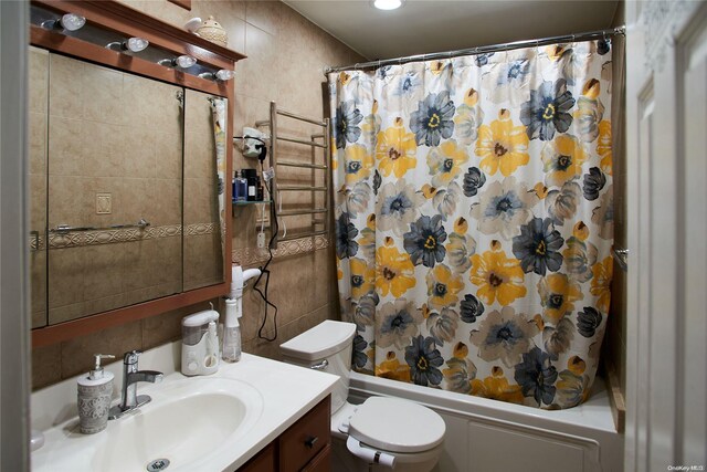 full bathroom featuring shower / bath combo, vanity, and toilet