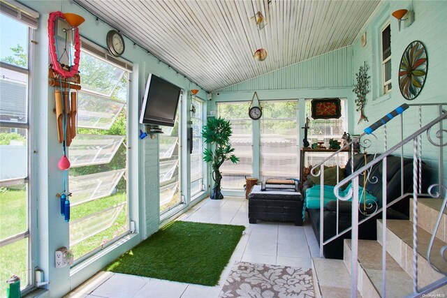 sunroom featuring wood ceiling and vaulted ceiling