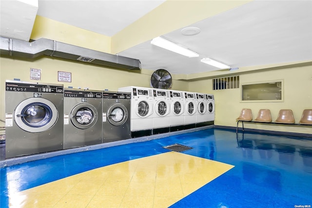 washroom with washing machine and dryer