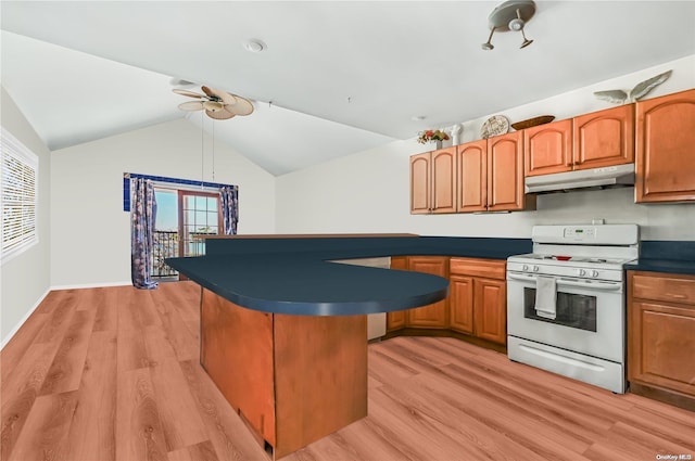 kitchen with white range oven, ceiling fan, vaulted ceiling, and light wood-type flooring