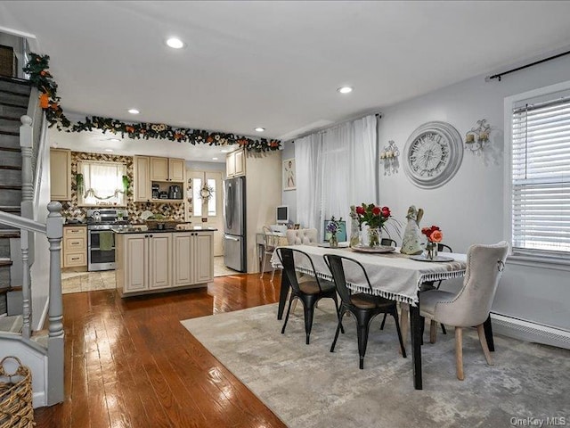 dining room with wood-type flooring