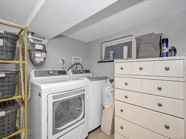 laundry room with independent washer and dryer