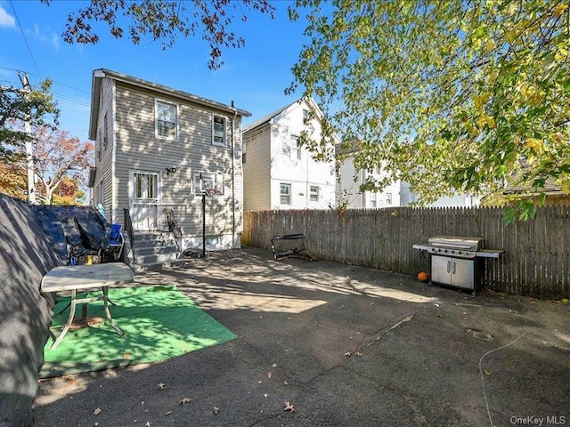 back of house with a patio