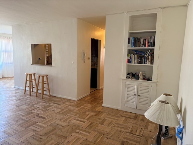 corridor with light parquet flooring