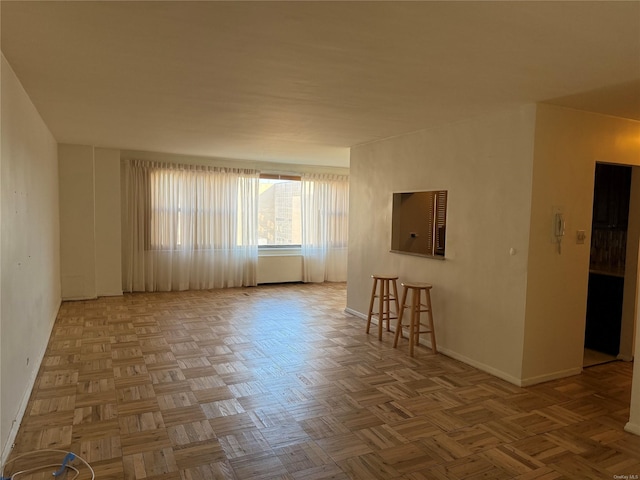 unfurnished room featuring light parquet floors