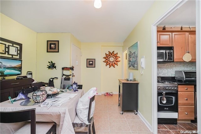 dining area with light tile patterned floors